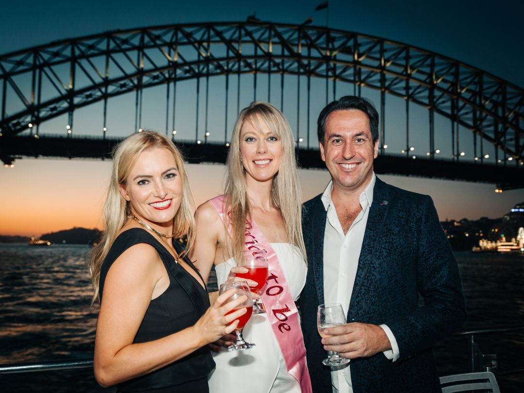 Engagement Party Boat Hire Sydney - Bride and Groom to be with Sydney Harbour Bridge