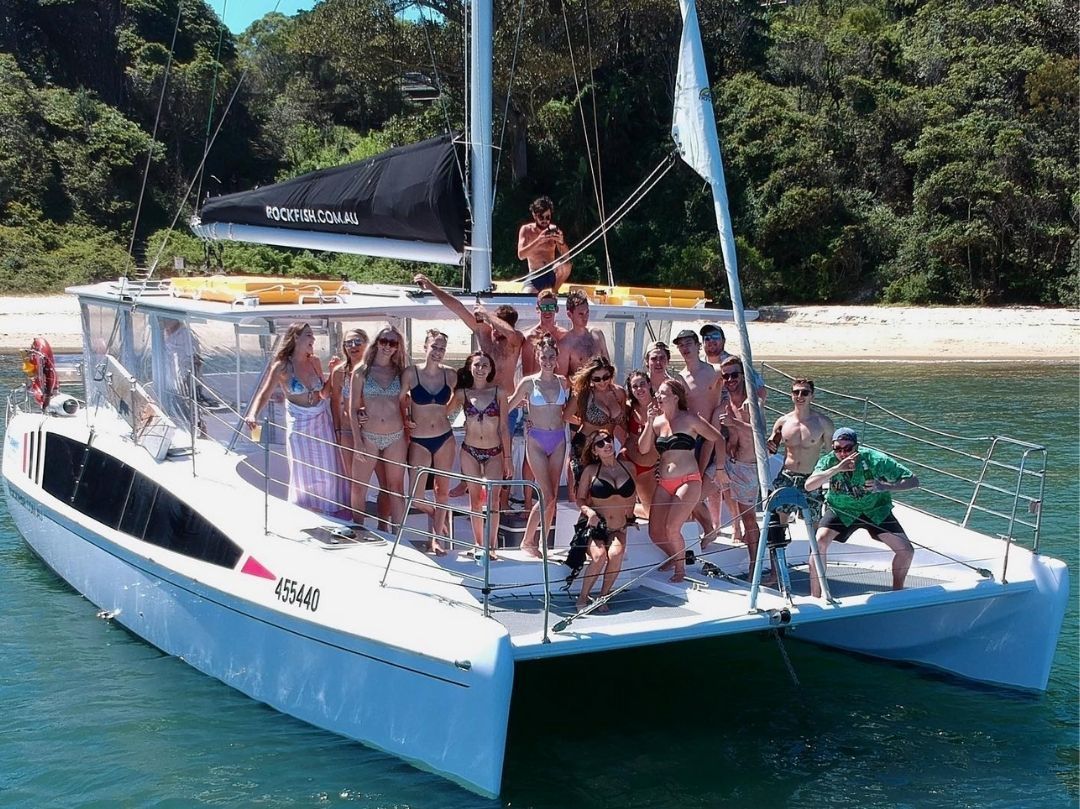 Private boat party group photo on Rockfish Catamaran Sydney Harbour