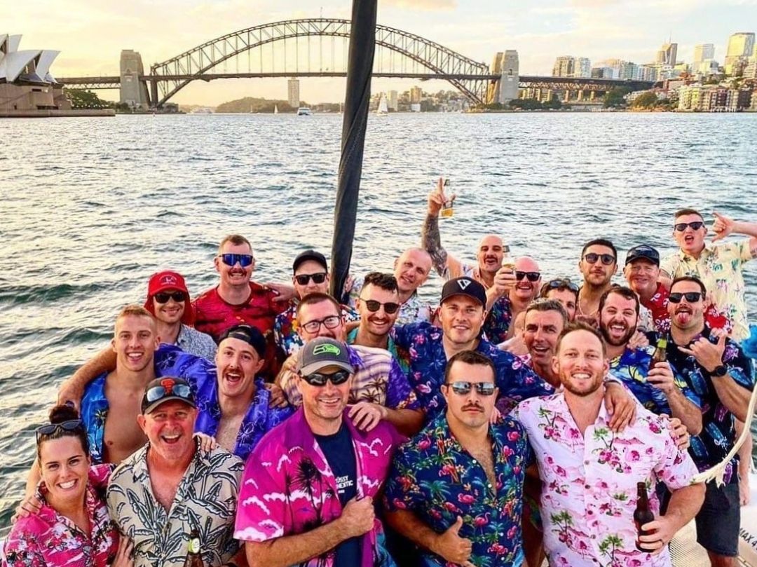 Bucks boat cruise group photo with Sydney Opera House and Sydney Harbour Bridge