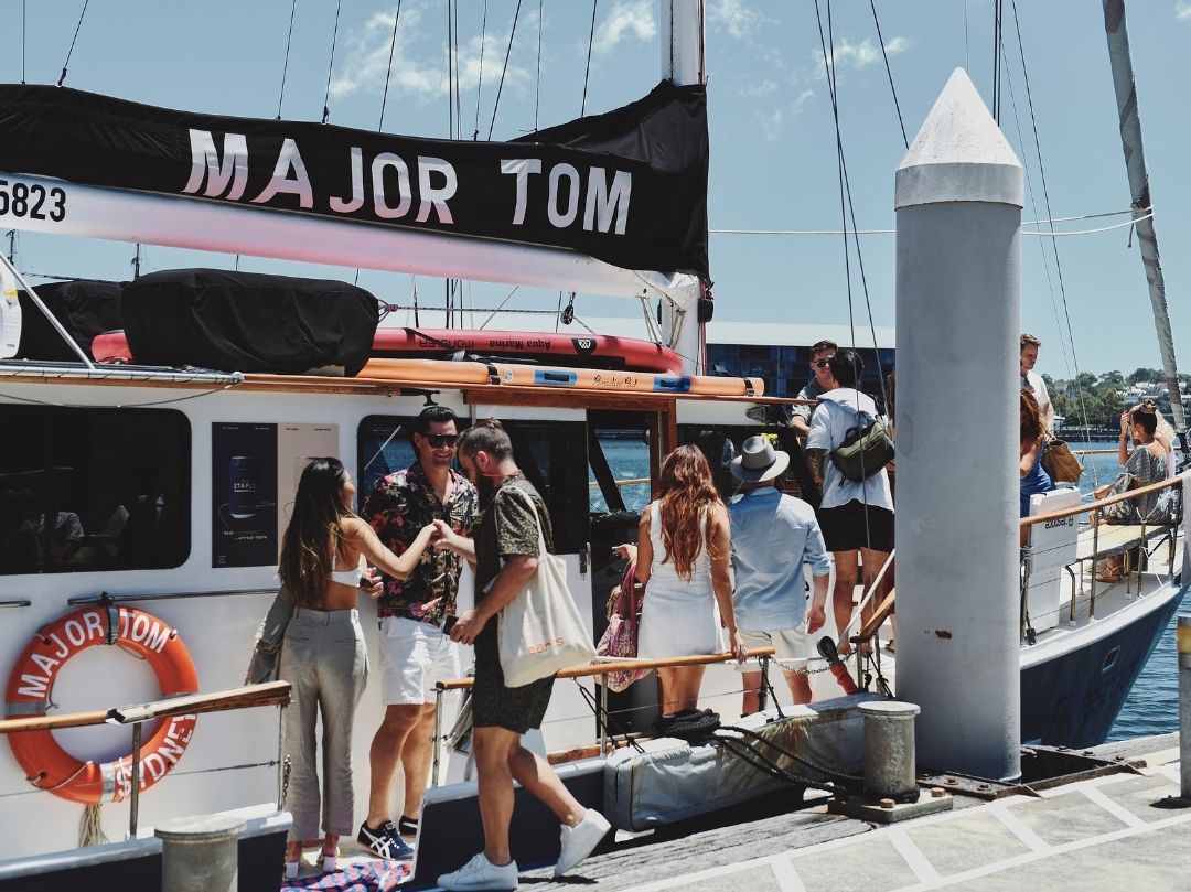 Major Tom - Group boarding at the wharf