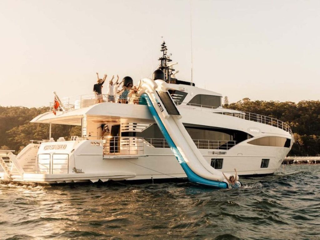 Oneworld superyacht hire - Sydney Harbour megayacht with jumbo waterslide